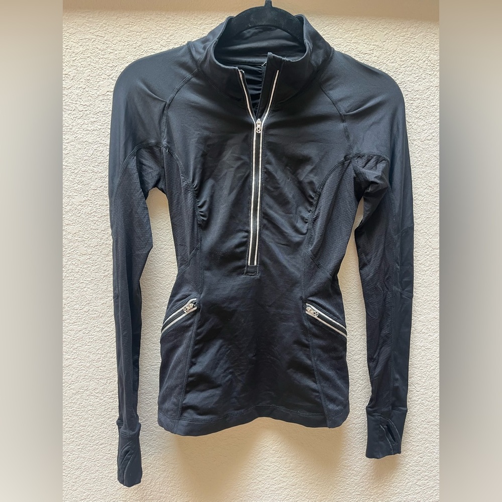 Lululemon black 1/2 zip long sleeve top.  Thumb holes. Size 4.